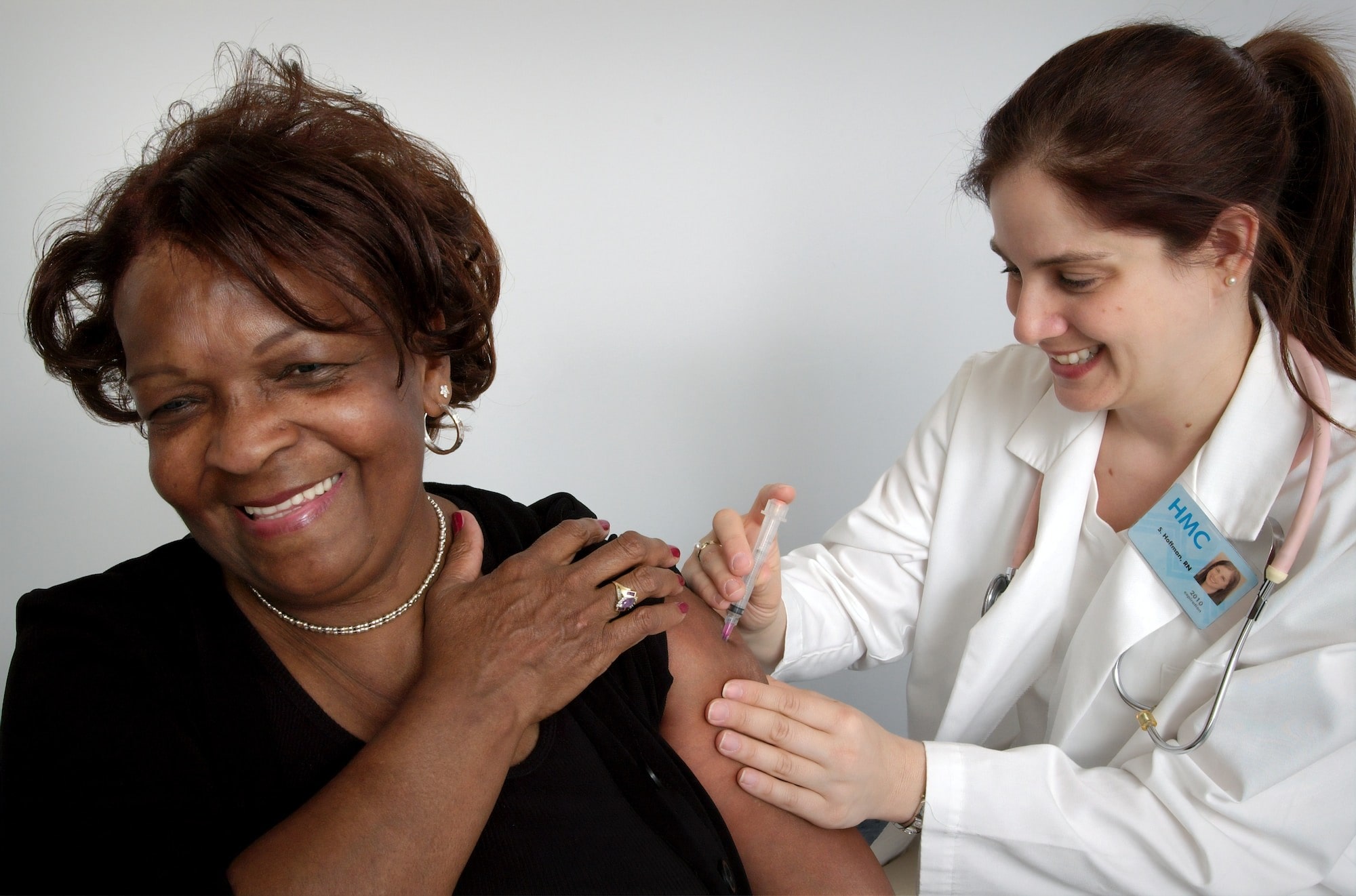 Text saying No Risk For You Or Your Doctor, and an image with a patient and a nurse administering a needle in her arm